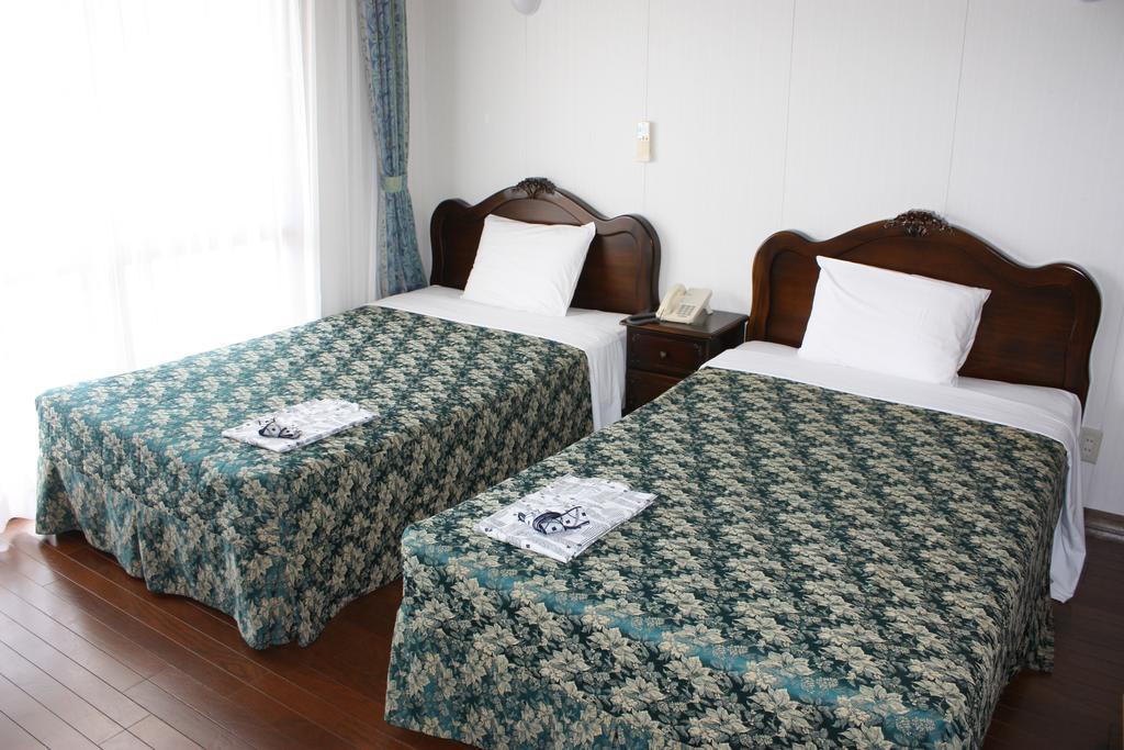 Morimar Resort Hotel Yomitan Quarto foto
